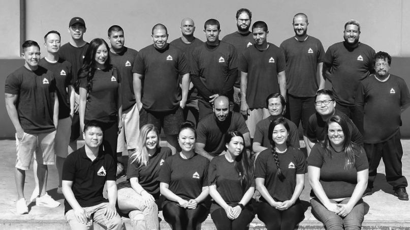 Group photo of the ARIEL Bath team wearing matching logo shirts, smiling and standing together in two rows. Group photo of the ARIEL Bath team wearing matching logo shirts, smiling and standing together in two rows.